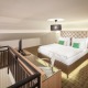 Dvoupodlažní rodinný apartmán typu Deluxe s manželskou postelí nebo oddělenými postelemi a balkónem - Pytloun Wellness Hotel Harrachov****