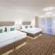 Rodinný pokoj typu Deluxe s manželskou postelí nebo oddělenými postelemi a balkónem - Pytloun Wellness Hotel Harrachov****